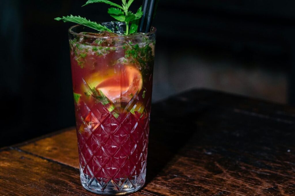 Home-made cocktail with fruit and garnishes.