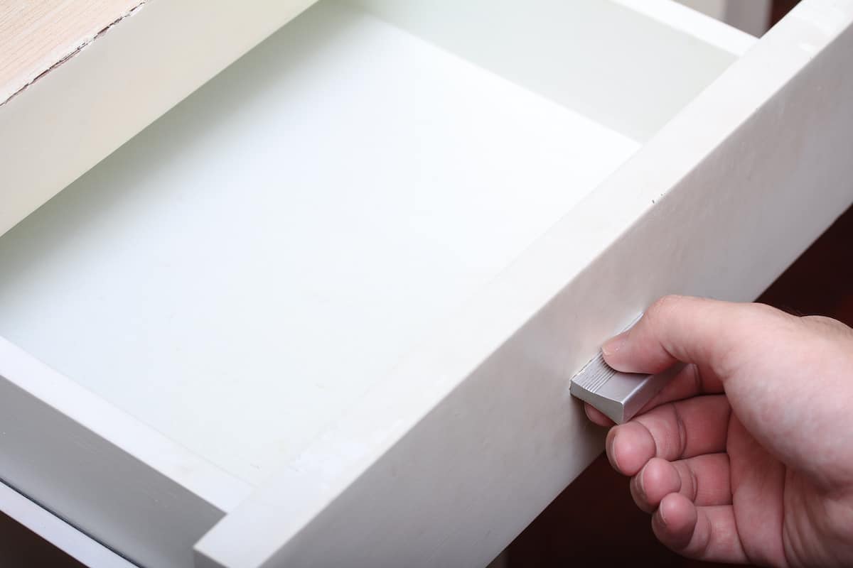 woman opening drawer