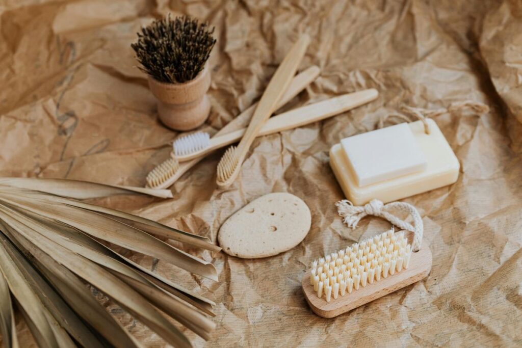 Tooth brushes, shower loofa made of natural fibers to illustrate zero-waste living alternatives