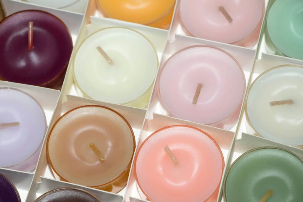 An array of scented candles in various colors
