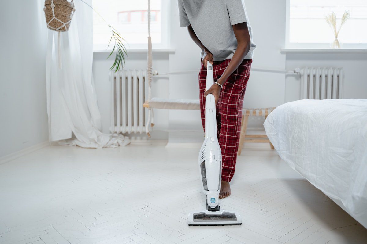 Vacuuming the floors apartment maintenance checklist
